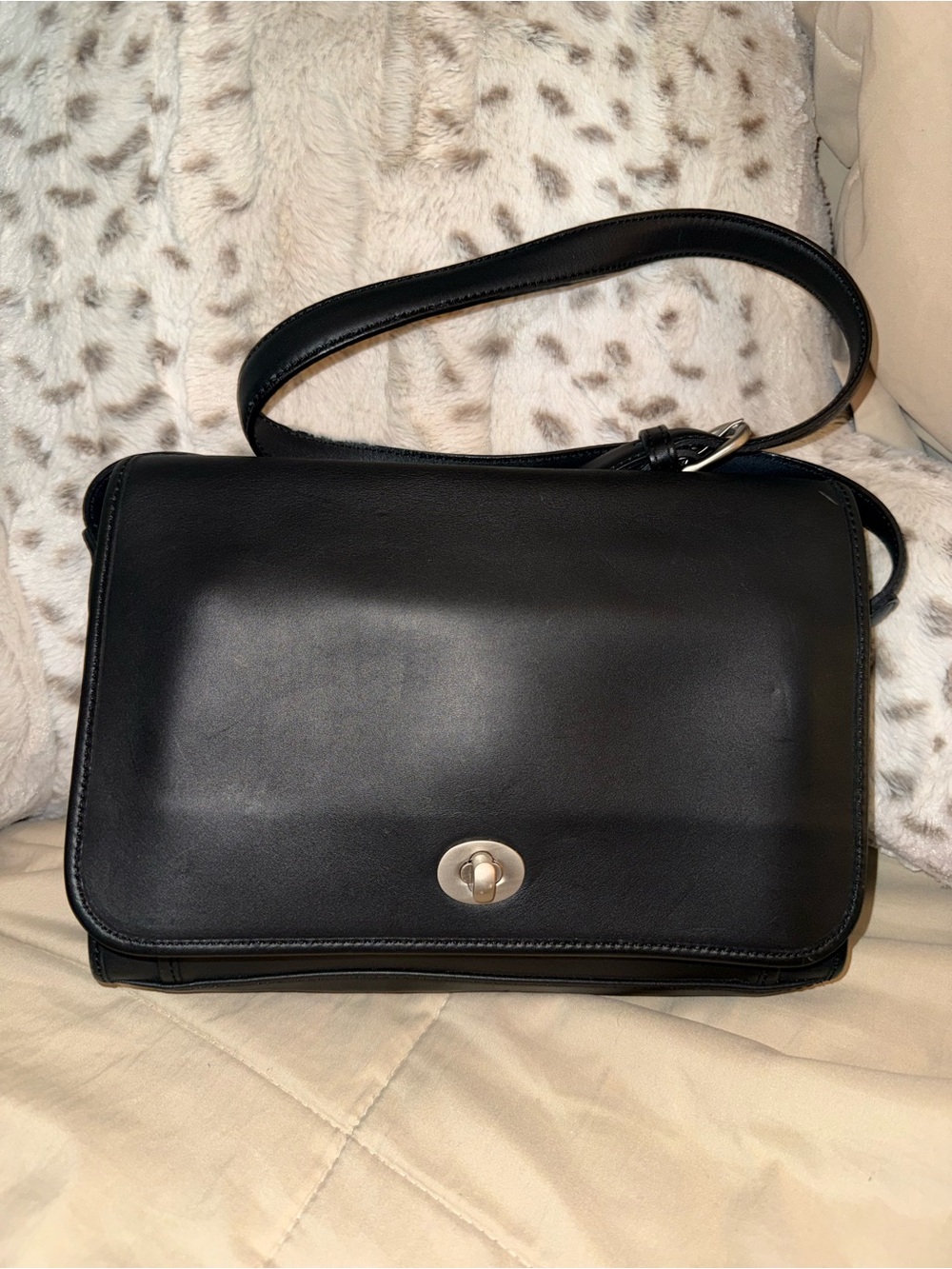 Cross body black leader coach purse.